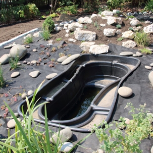 unfinished landscape garden pond