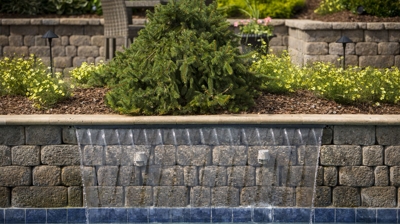 Stone wall with a small water feature. Photo