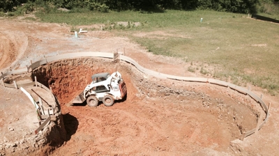 Pool excavation with small bulldozer. Photo
