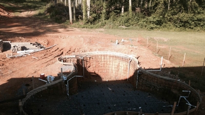 A pool's concrete foundation is under construction. Photo