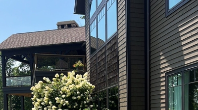 A house with landscaping and a yard. Photo