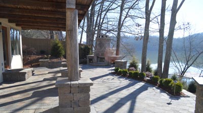 An outdoor patio area with a fire place. Photo