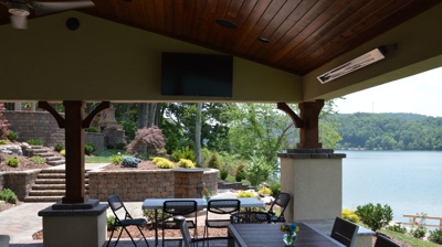 Lakefront patio with dining and covered seating. Photo