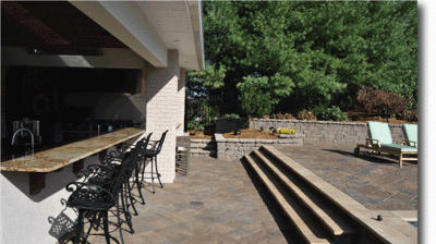 Outdoor kitchen, bar, patio, pool area. Photo
