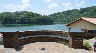 Curved stone wall with brown stones Photo