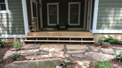 Stone walkway leading to a house porch Photo